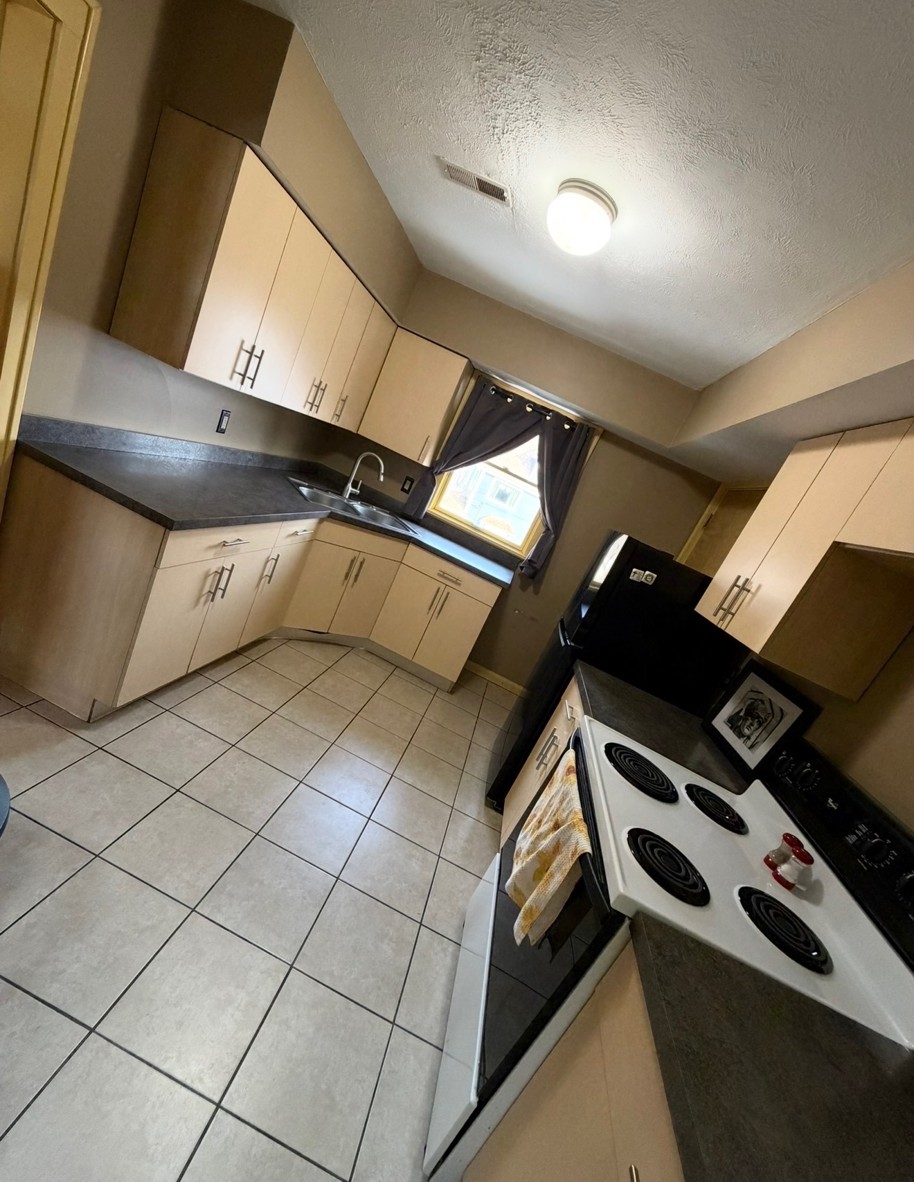 Kitchen before the Christmas Story House rentable loft remodel